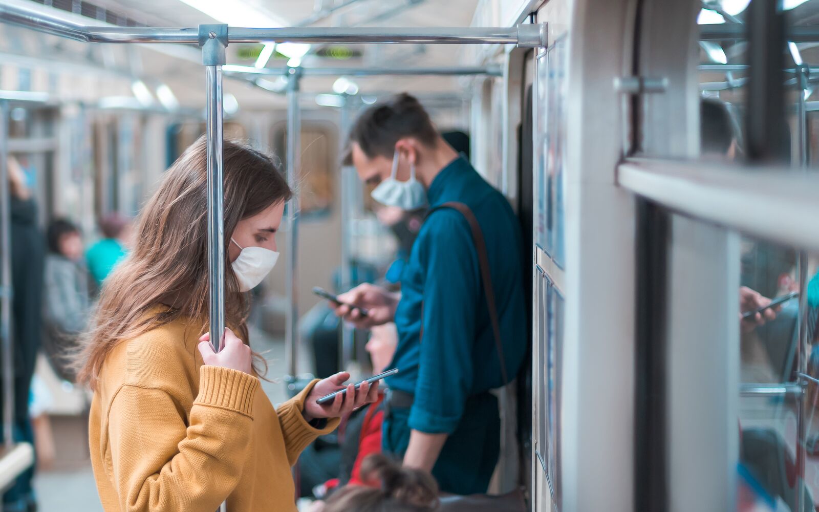 variety of passengers ride the subway car